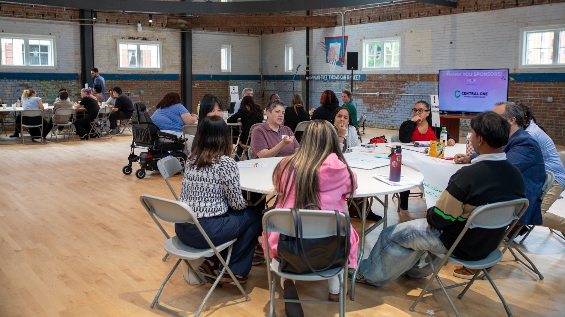 Participants in a career station conversation at round tables