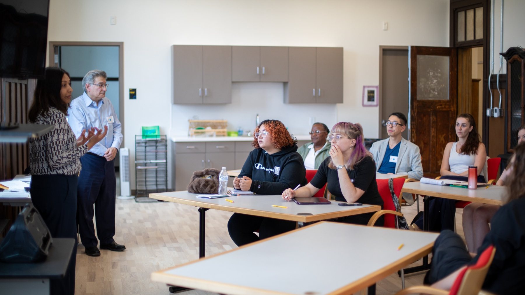 Classroom-style workshop with participants listening